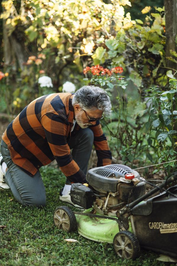 Mechanic working on a lawn mower